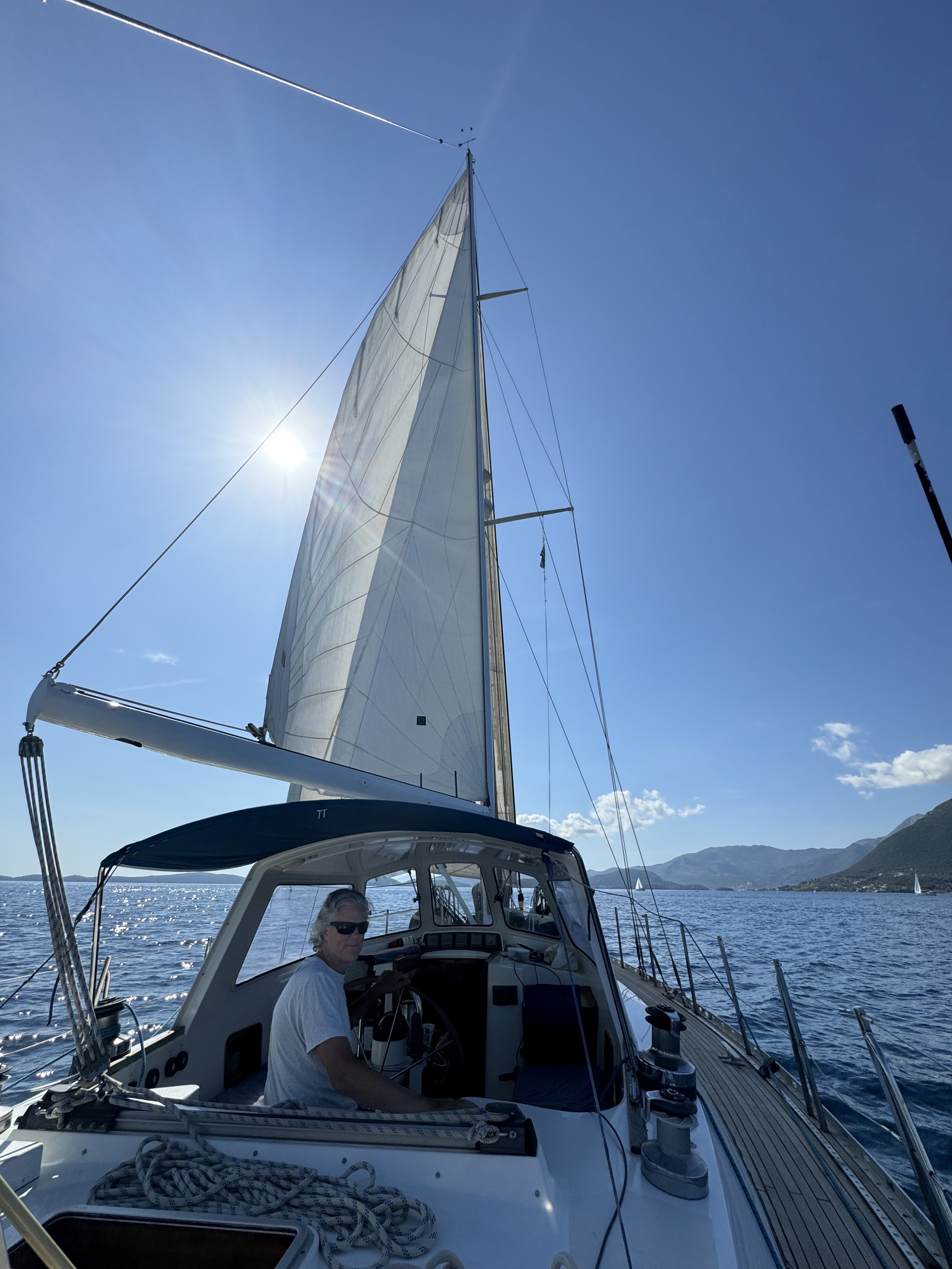 Fenna sailing across the bright blue water